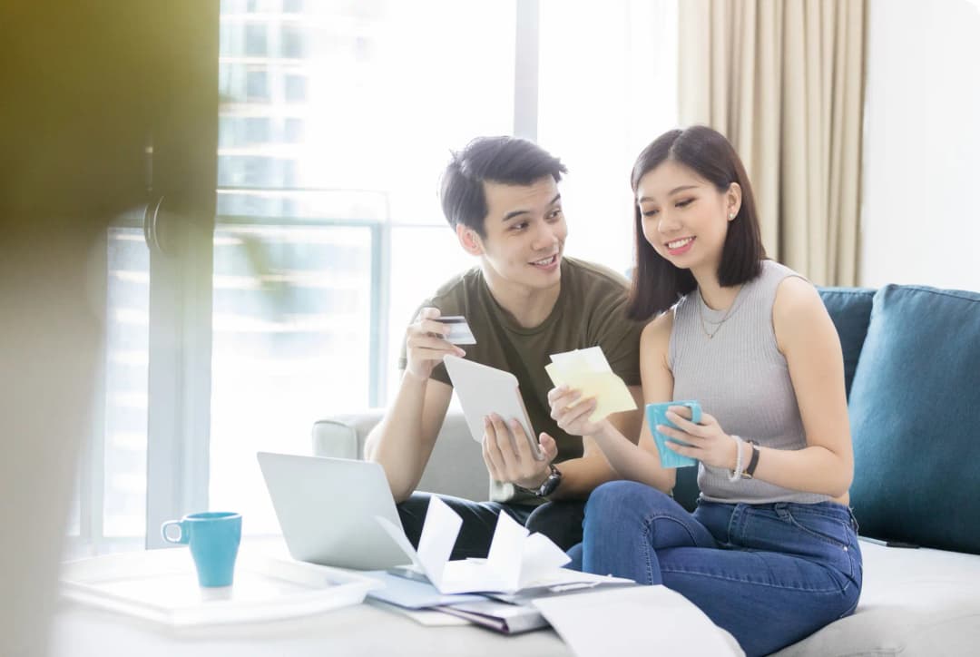A couple reviewing documents happily