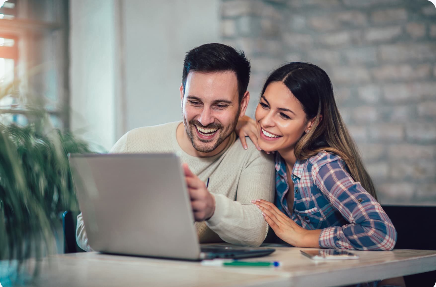 Couple looking at laptop