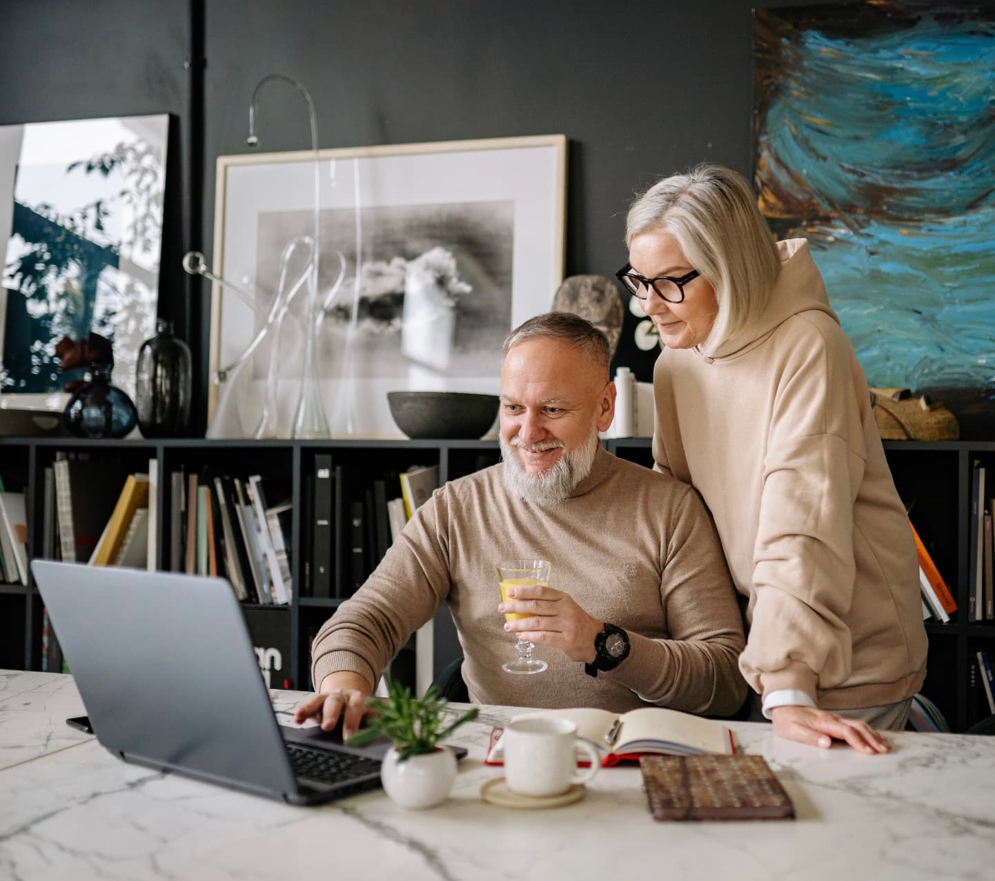 Retired couple reviewing their reverse mortgage options at home