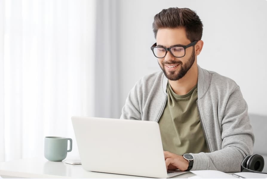 Broker reviewing mortgage documents on a laptop