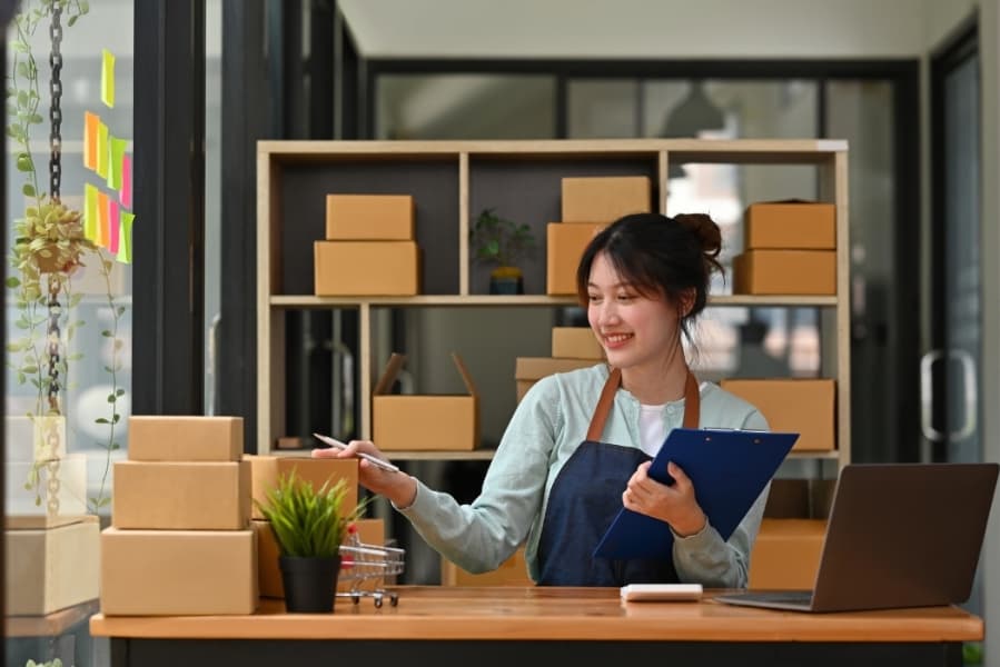 Self-employed business owner working in her shop