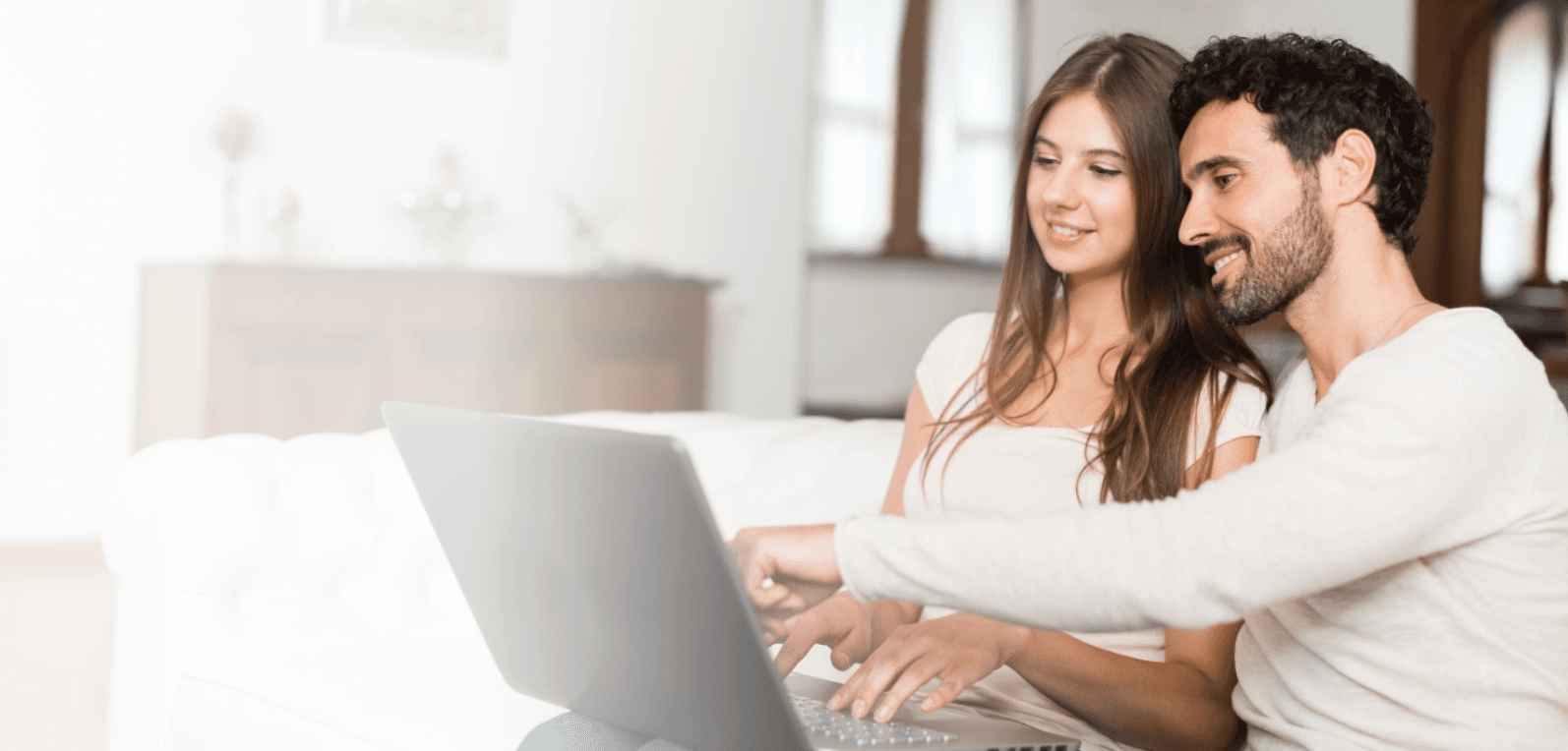 Couple looking at laptop